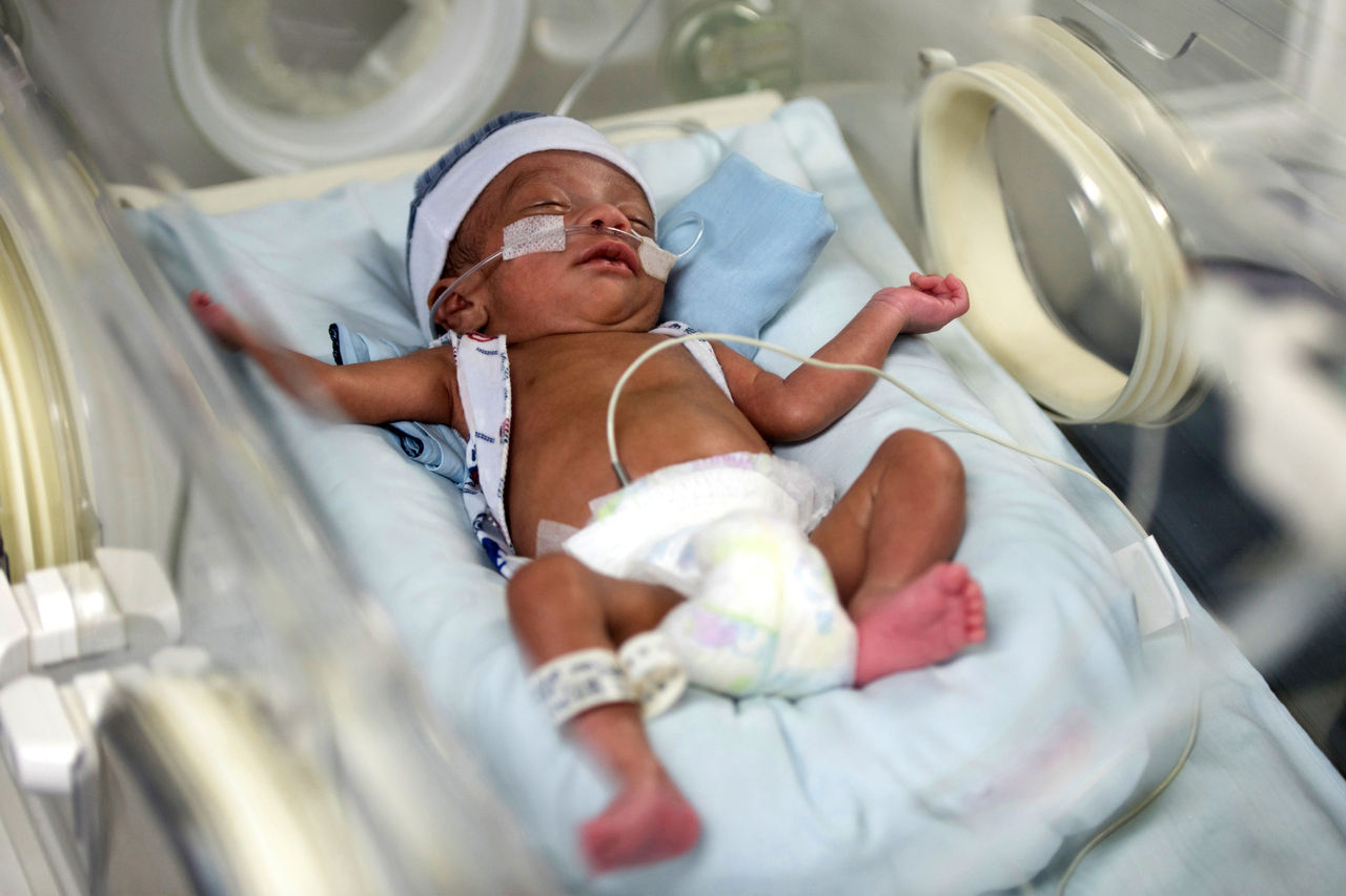 African American NICU baby in an incubator.